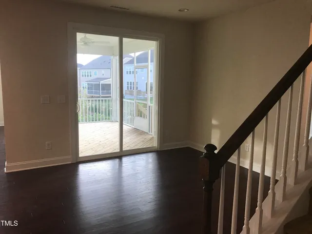a view of an entryway with wooden floor