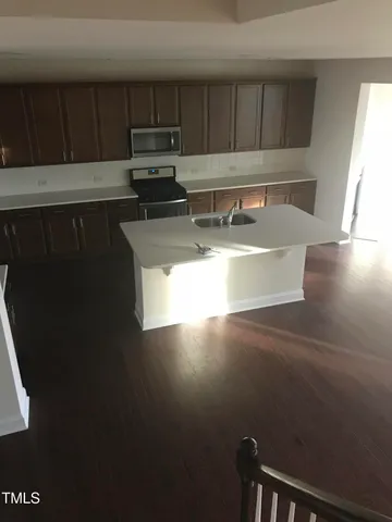 view of kitchen with sink microwave and cabinets