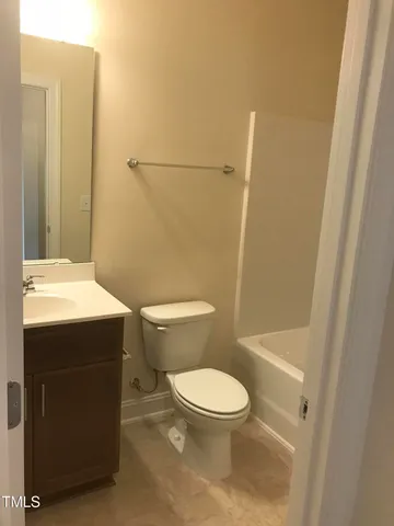 a bathroom with a toilet and a sink