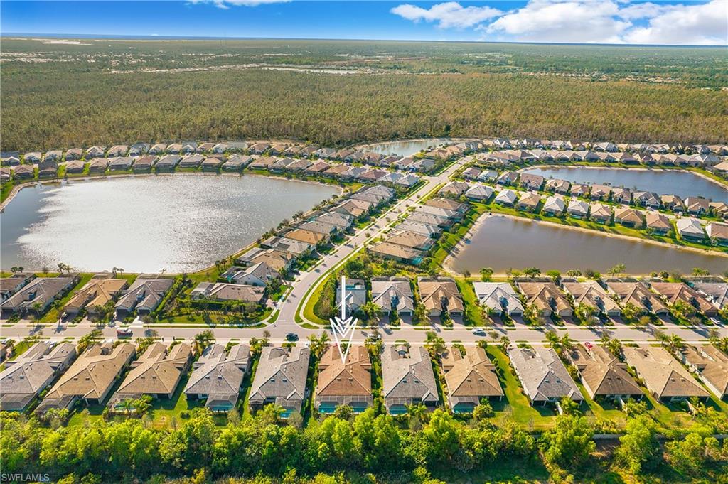 7674 Jacaranda Lane Naples, FL 34114 - Photo 30 of 45 an aerial view of residential building and lake