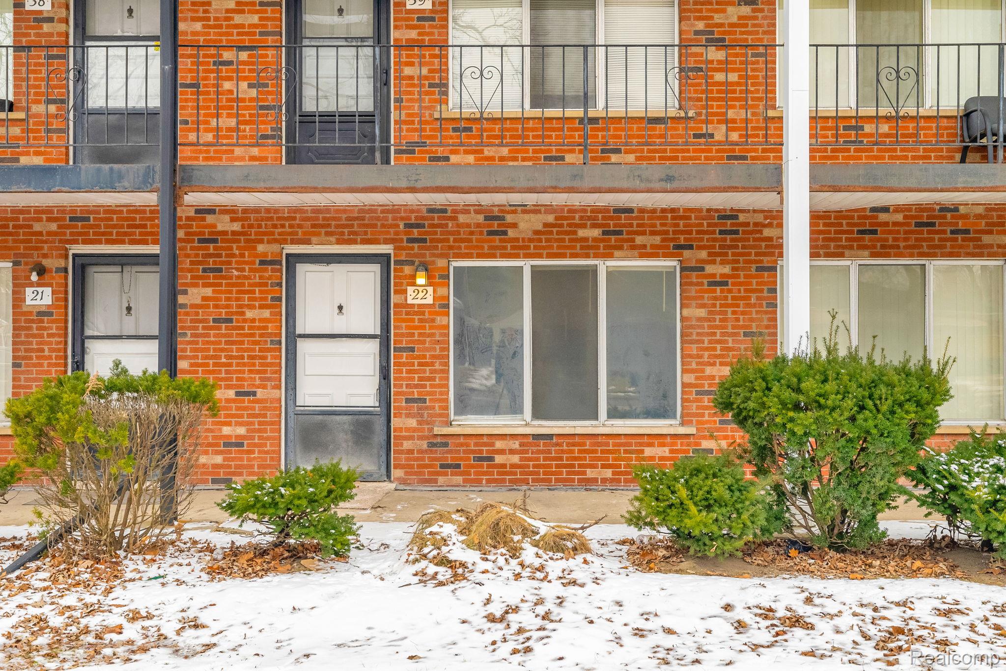 4535 Cadieux Road, Unit 42 / 210 Detroit, MI 48224 - Photo 3 of 16 Snow covered property entrance with brick siding