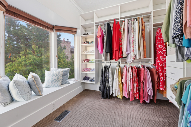 2342 Charros Road Sandy, UT 84092 - Photo 39 of 94 Custom closet system featuring hanging rods, shelving, and built-in drawers