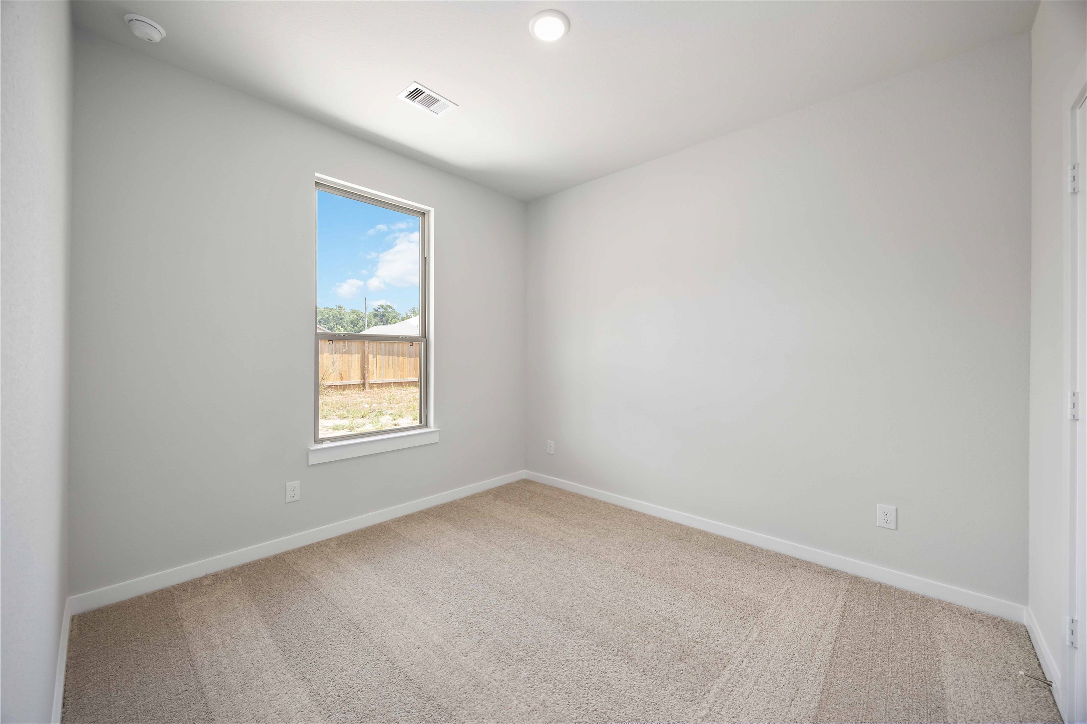10943 Independence Road Cleveland, TX 77328 - Photo 16 of 31 an empty room with a window