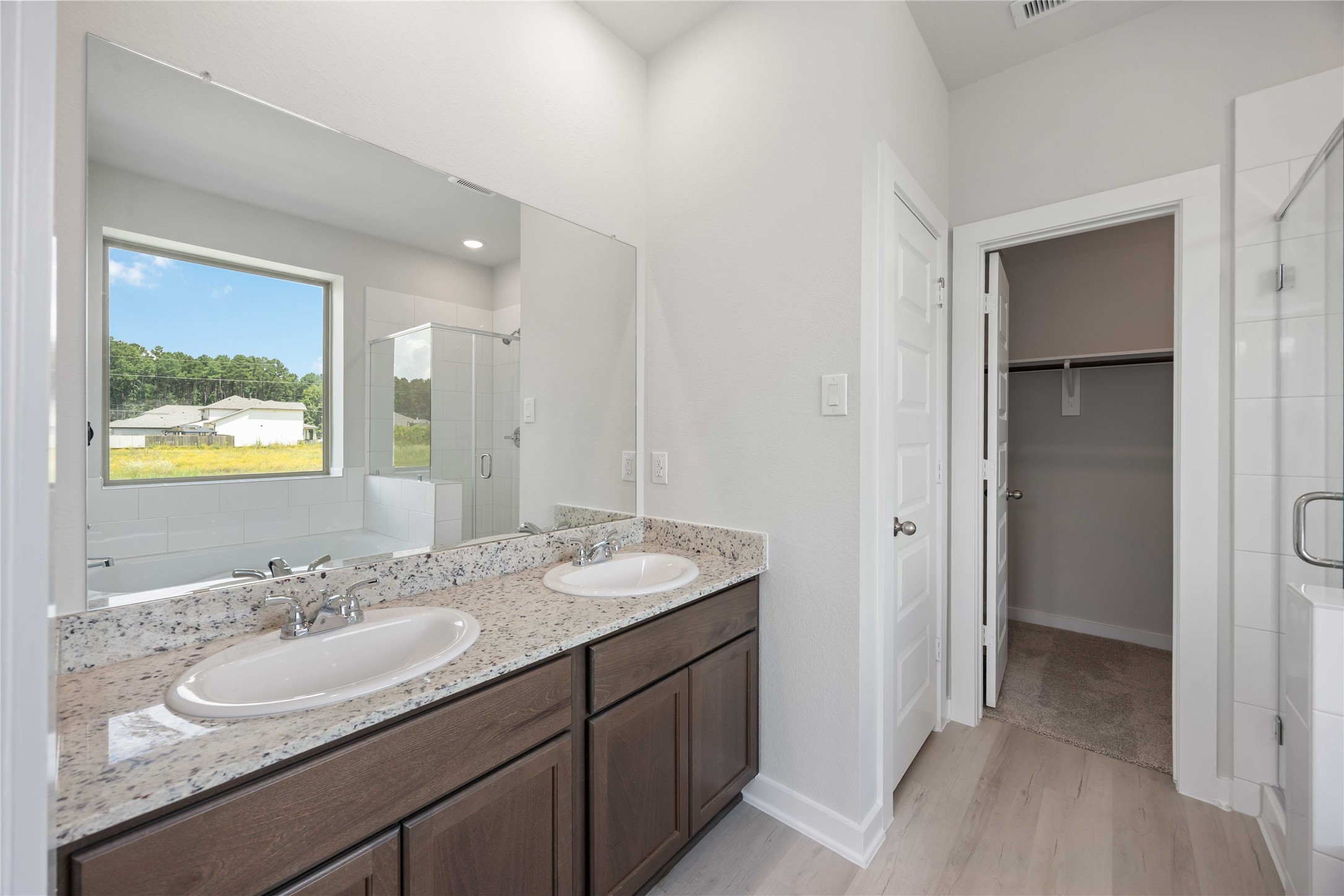 10943 Independence Road Cleveland, TX 77328 - Photo 19 of 31 a bathroom with a sink and a mirror