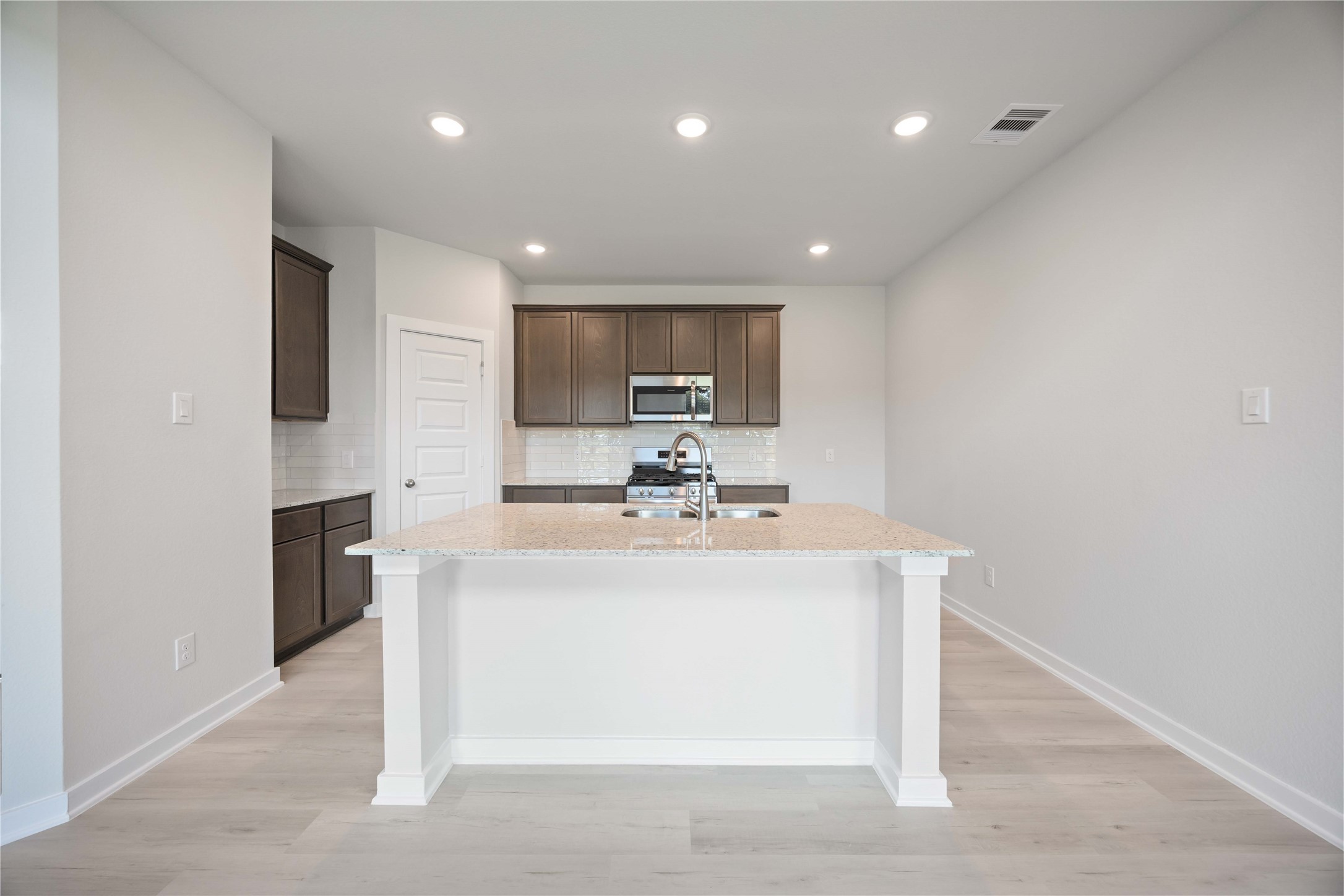 10943 Independence Road Cleveland, TX 77328 - Photo 5 of 31 a view of kitchen with sink refrigerator and window