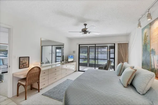 a bed room with a bed and a chandelier