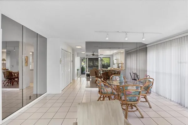 a dining room with furniture and window