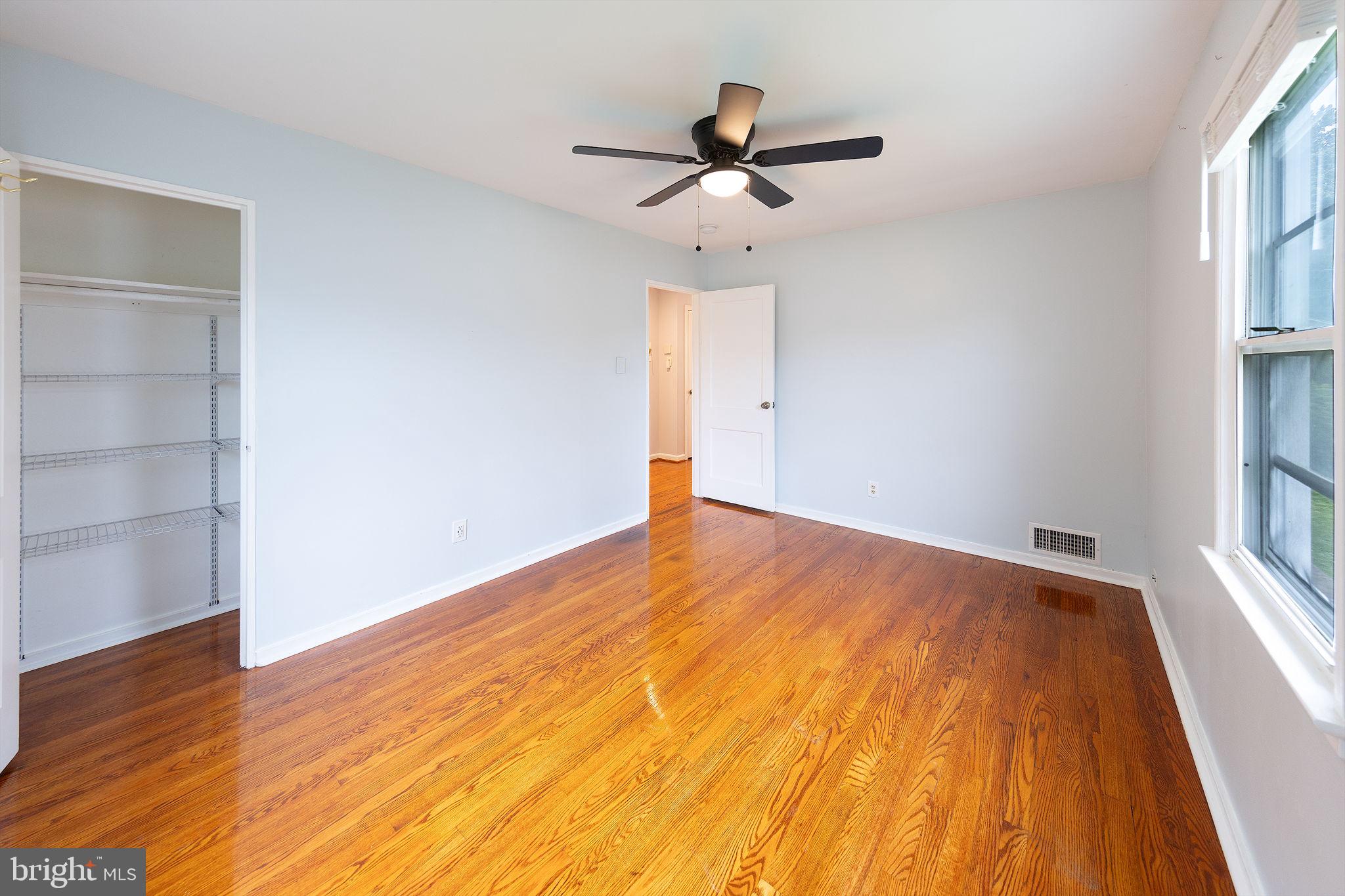 3321 Clay Street Silver Spring, MD 20902 - Photo 18 of 41 a view of empty room with wooden floor and fan