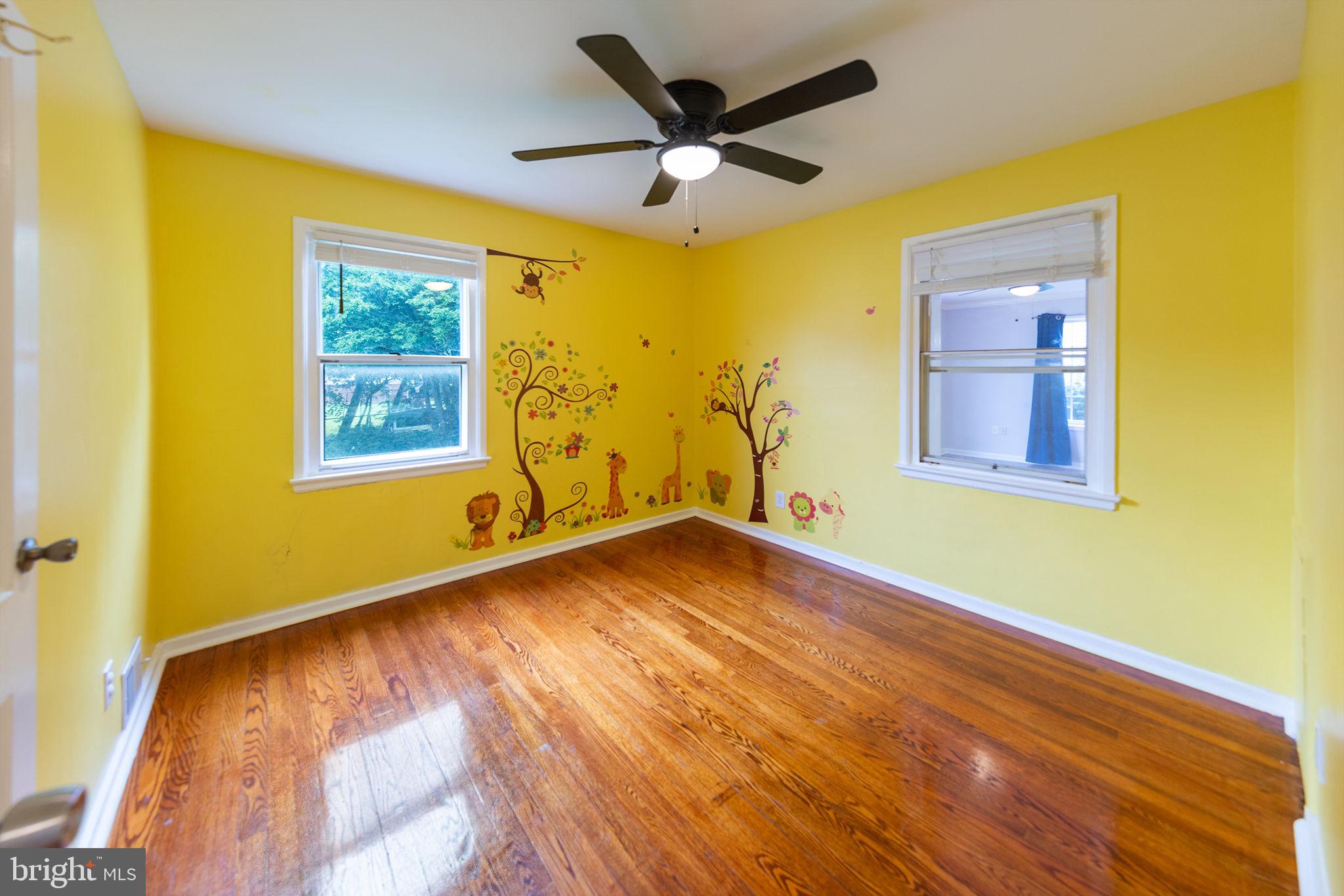 3321 Clay Street Silver Spring, MD 20902 - Photo 21 of 41 a view of an empty room with a window and wooden floor