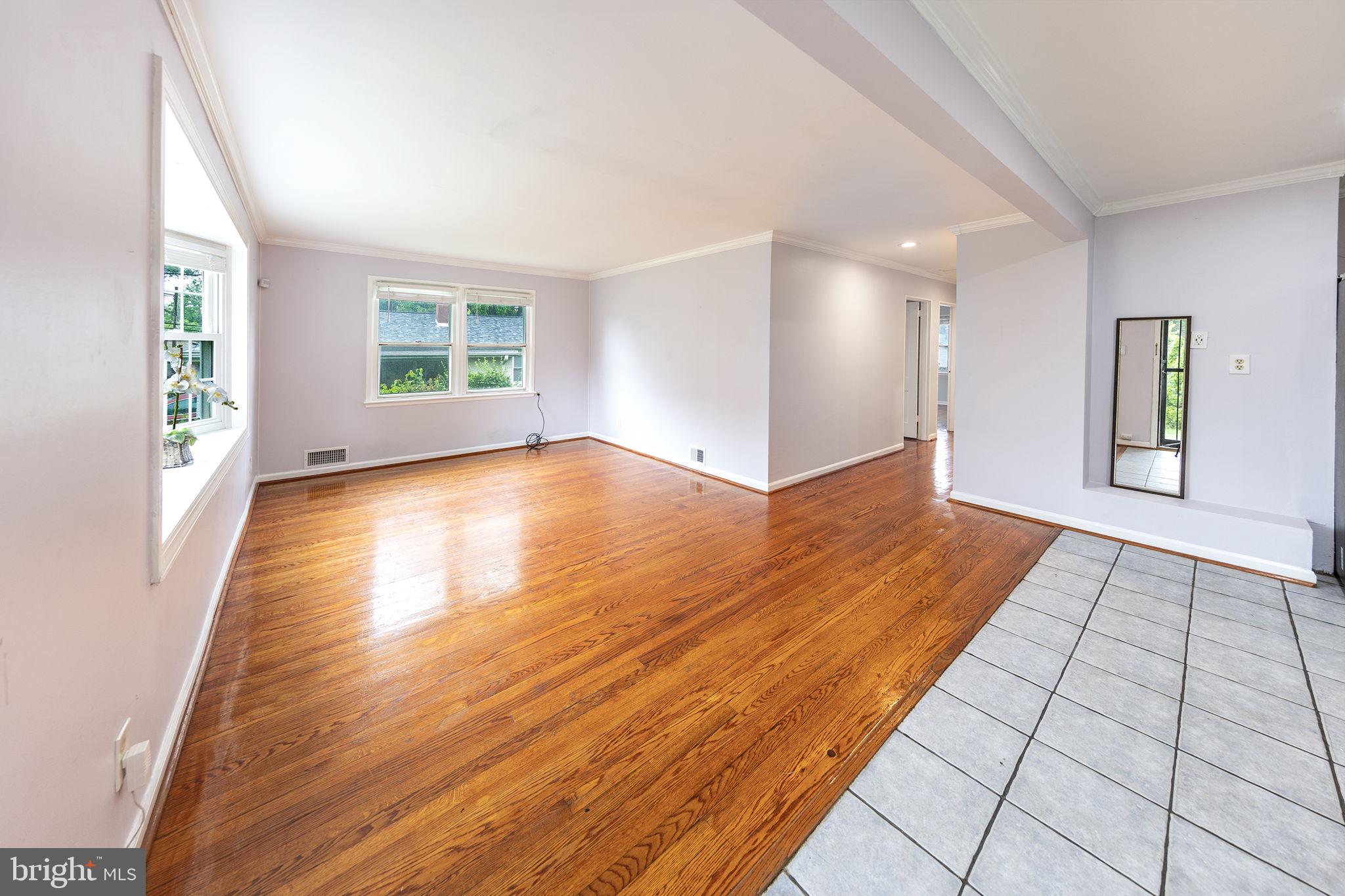3321 Clay Street Silver Spring, MD 20902 - Photo 4 of 41 a view of an empty room with window and wooden floor