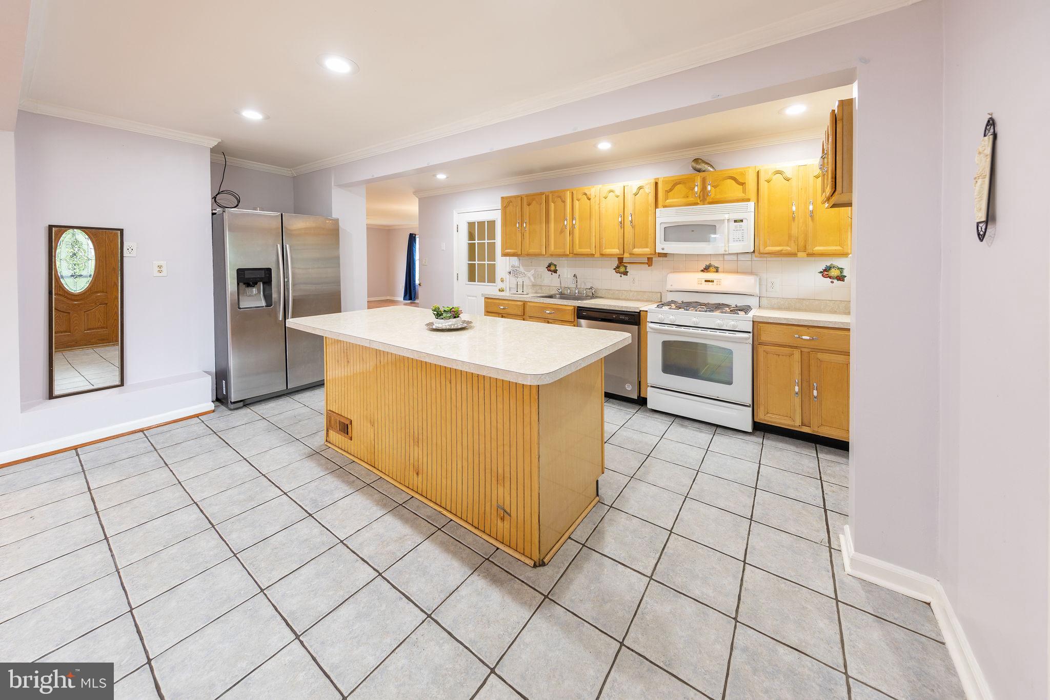 3321 Clay Street Silver Spring, MD 20902 - Photo 6 of 41 a kitchen with a stove a sink and a refrigerator