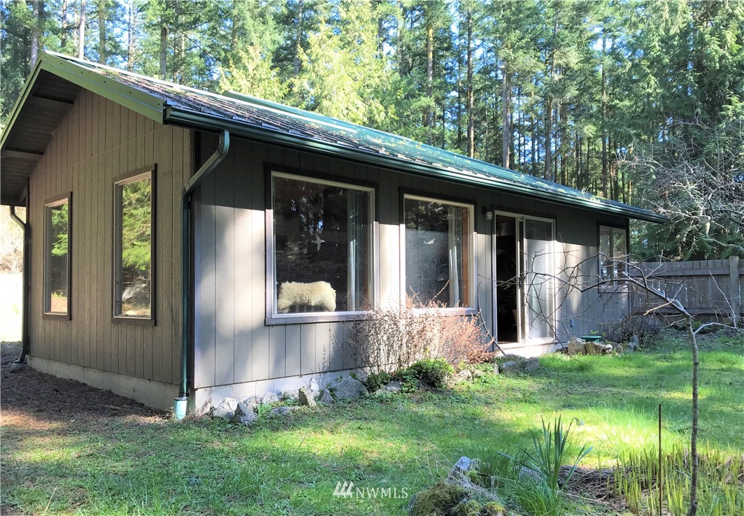 53 Cross Road Lopez Island, WA 98261 - Photo 1 of 20 a view of house with backyard
