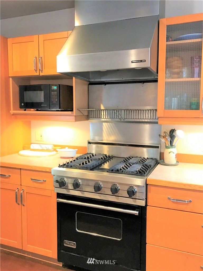53 Cross Road Lopez Island, WA 98261 - Photo 12 of 20 a stove top oven sitting inside of a kitchen