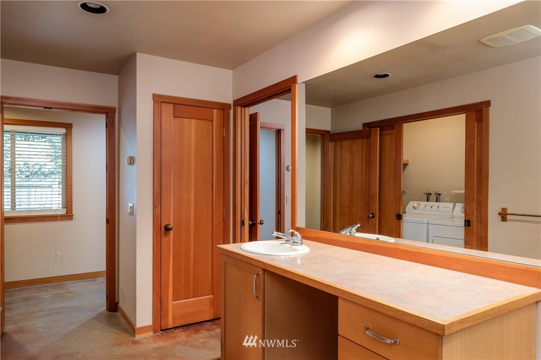 53 Cross Road Lopez Island, WA 98261 - Photo 18 of 20 a room with a sink and a mirror