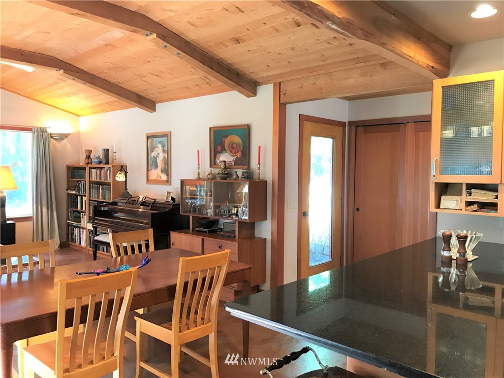 53 Cross Road Lopez Island, WA 98261 - Photo 4 of 20 a dining room with furniture and wooden floor