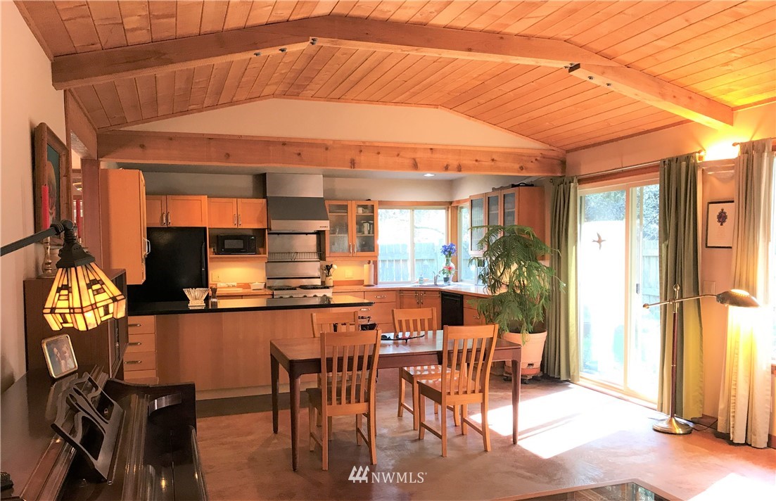 53 Cross Road Lopez Island, WA 98261 - Photo 8 of 20 a view of a dining room with furniture window and outside view
