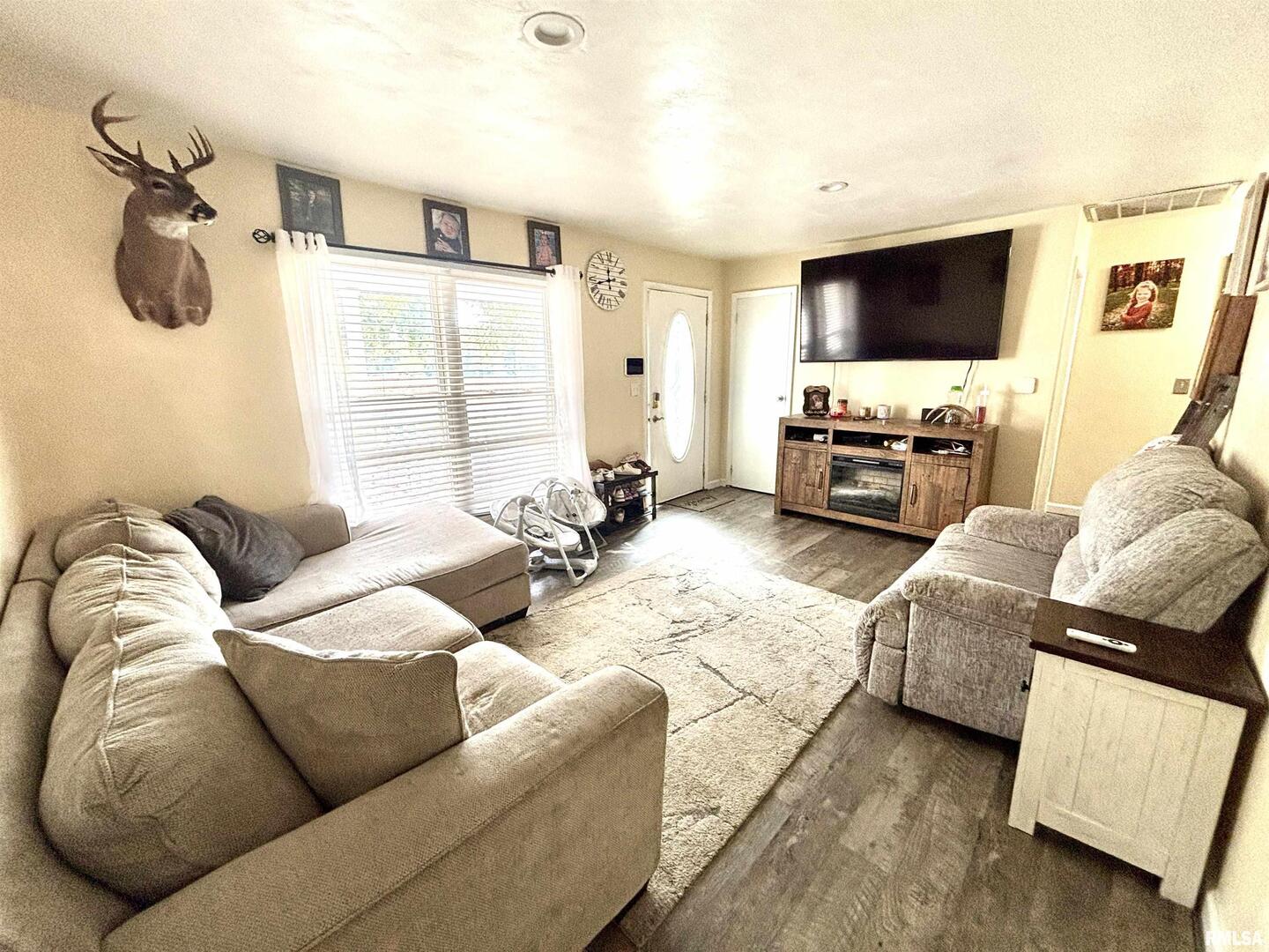 1012 West 4th Street Centralia, IL 62801 - Photo 7 of 20 a living room with furniture and a flat screen tv