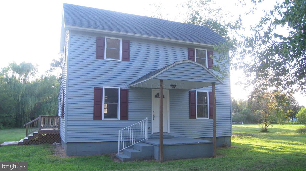 9920 Champ Road Princess Anne, MD 21853 - Photo 2 of 12 a view of a house with a yard
