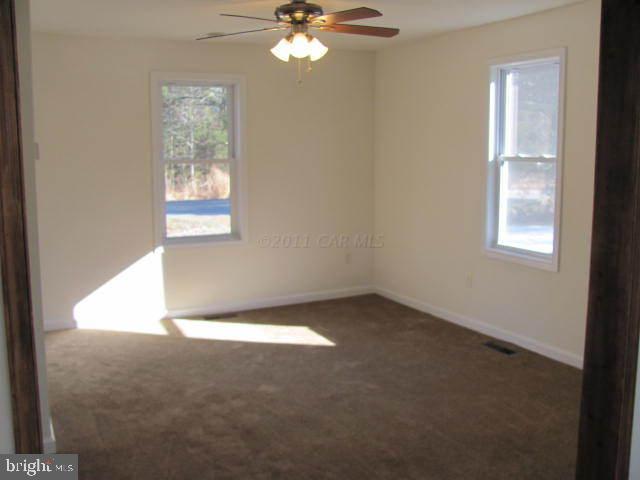 9920 Champ Road Princess Anne, MD 21853 - Photo 12 of 12 an empty room with a window