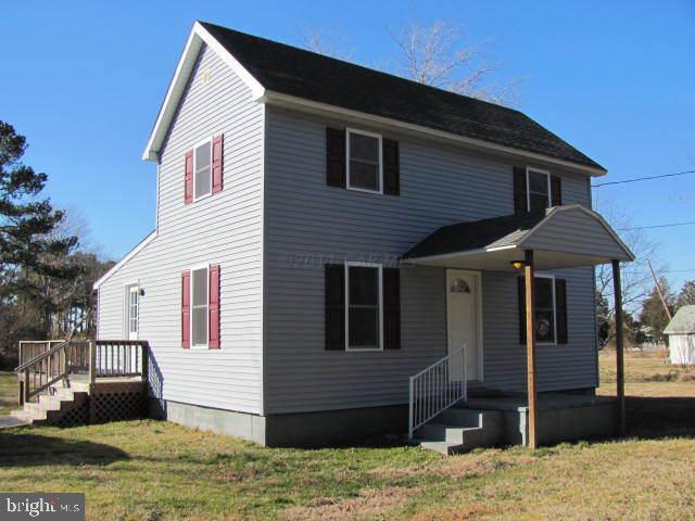 9920 Champ Road Princess Anne, MD 21853 - Photo 4 of 12 a front view of a house with a yard