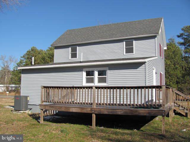 9920 Champ Road Princess Anne, MD 21853 - Photo 5 of 12 a front view of a house with a deck