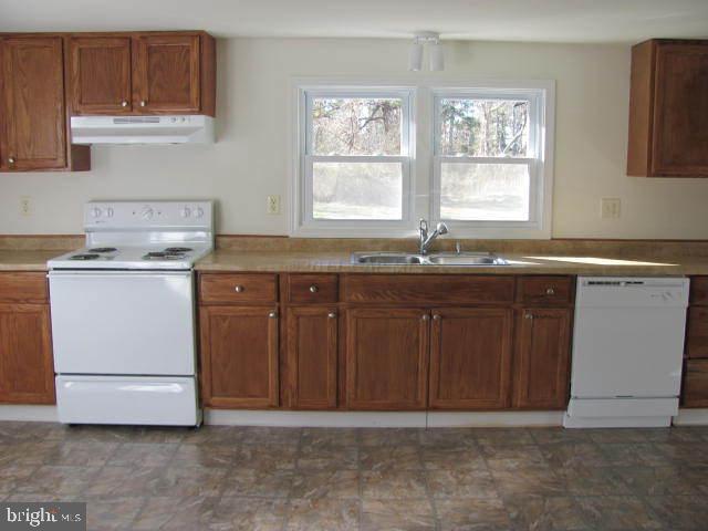 9920 Champ Road Princess Anne, MD 21853 - Photo 6 of 12 a kitchen with a sink and cabinets