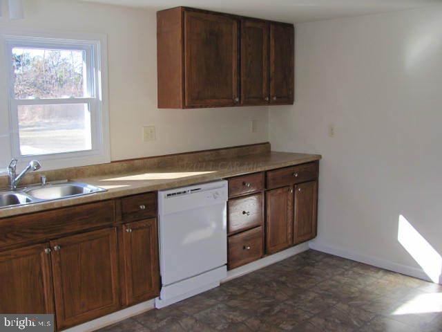 9920 Champ Road Princess Anne, MD 21853 - Photo 8 of 12 a kitchen with a sink cabinets and a window