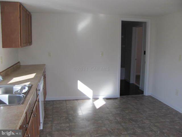 9920 Champ Road Princess Anne, MD 21853 - Photo 9 of 12 a view of a livingroom with a fireplace