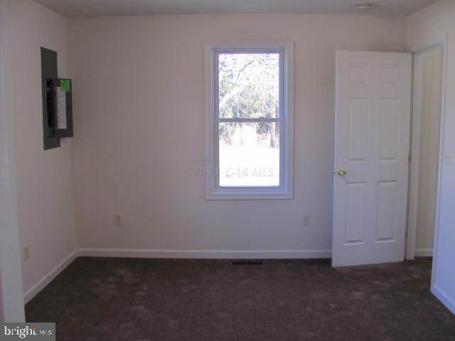 9920 Champ Road Princess Anne, MD 21853 - Photo 10 of 12 an empty room with a window