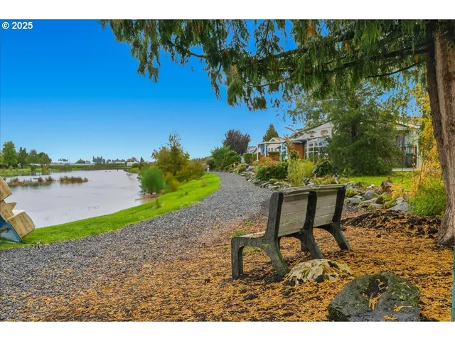 a view of a lake with a yard