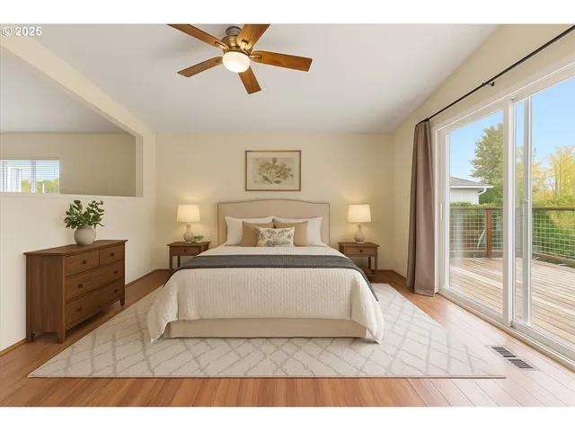 a bedroom with a large bed and a window