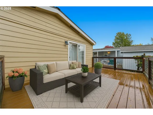 a balcony with furniture and wooden floor