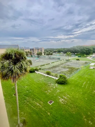 a view of a back yard from a balcony