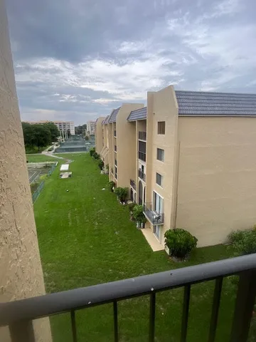 a bed sitting in a bedroom and wooden floor