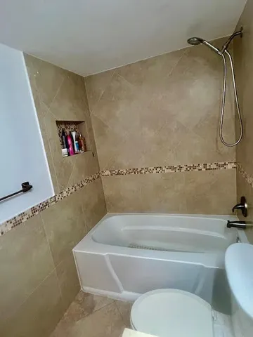 a bedroom with furniture and window