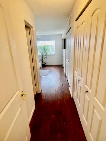 a black and white bed in a white room