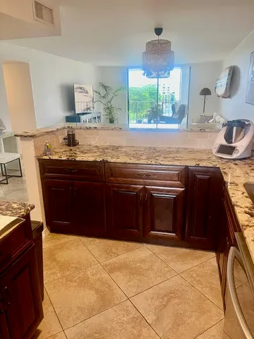 a kitchen with a stove and a sink