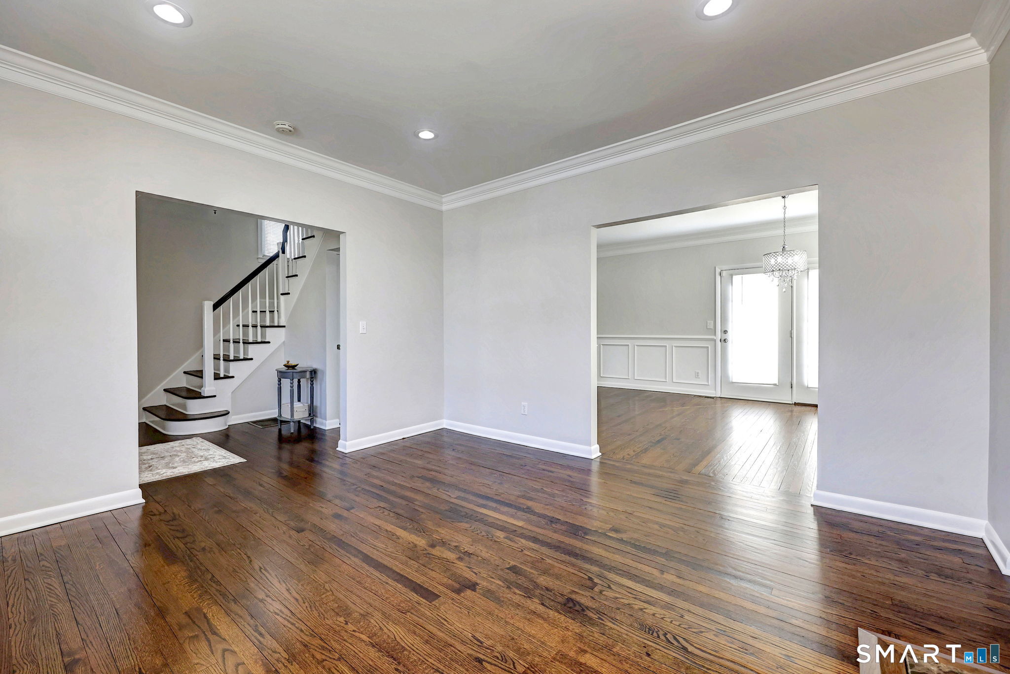 40 Yale Street Stratford, CT 06615 - Photo 13 of 31 an empty room with wooden floor and staircase