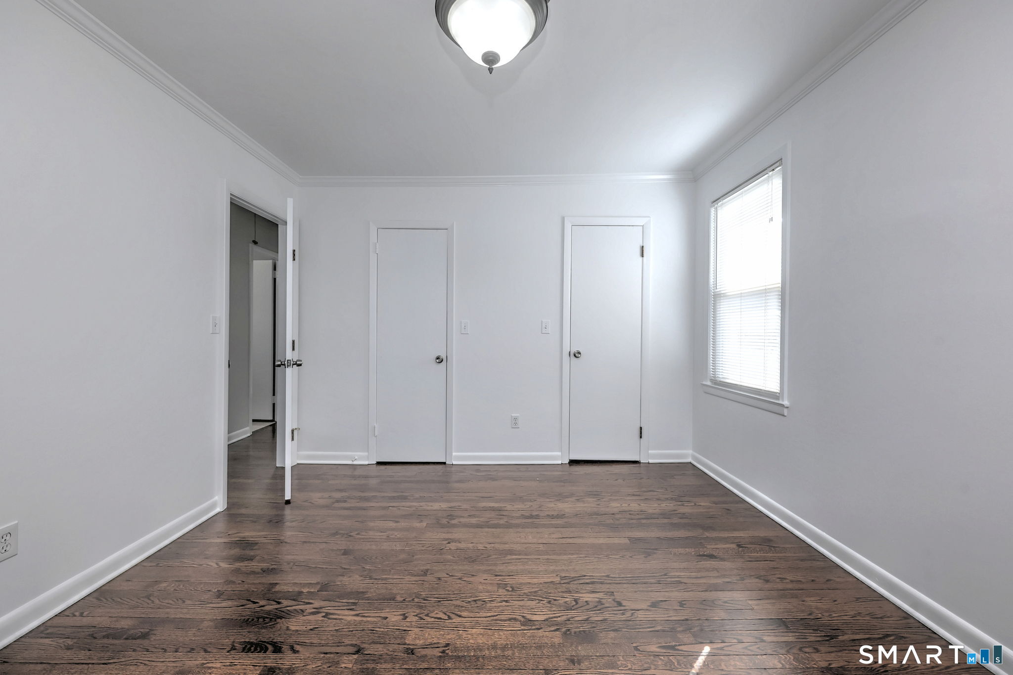 40 Yale Street Stratford, CT 06615 - Photo 18 of 31 an empty room with wooden floor and window