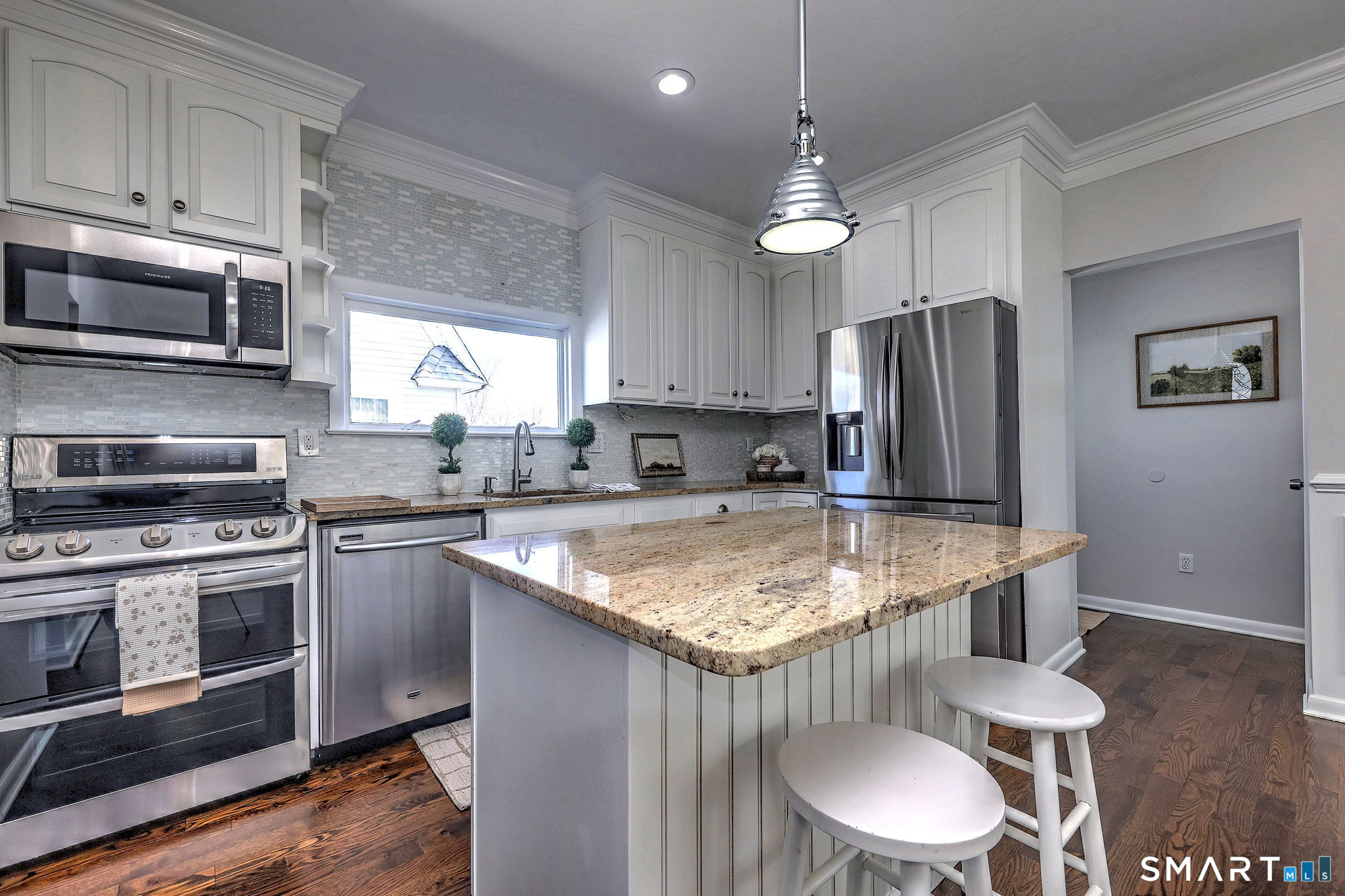 40 Yale Street Stratford, CT 06615 - Photo 2 of 31 a kitchen with stainless steel appliances granite countertop a sink a stove a refrigerator and island