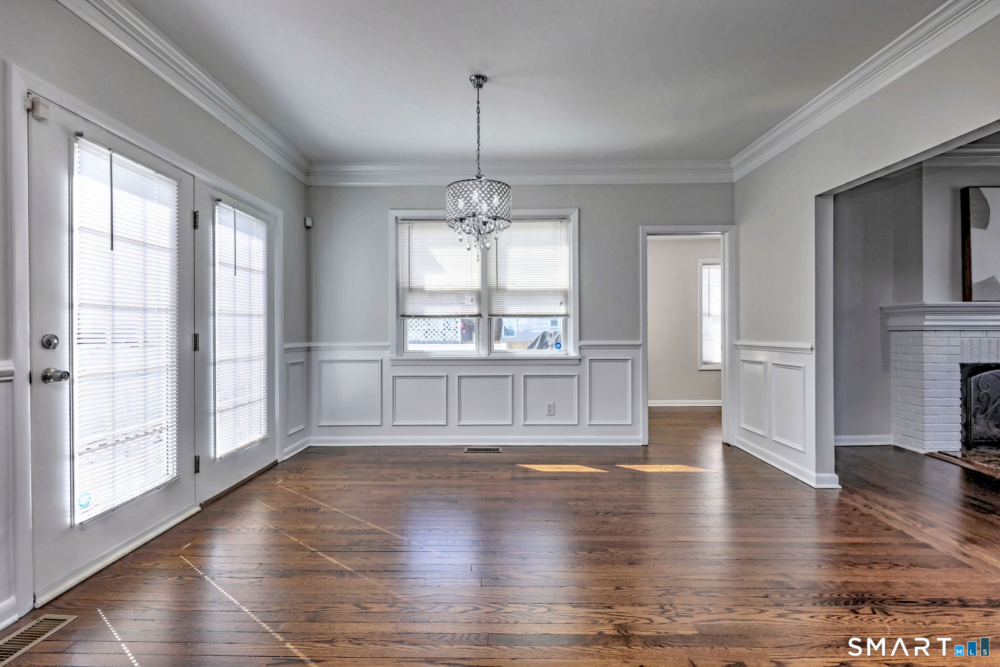 40 Yale Street Stratford, CT 06615 - Photo 3 of 31 a view of an empty room with wooden floor and a window
