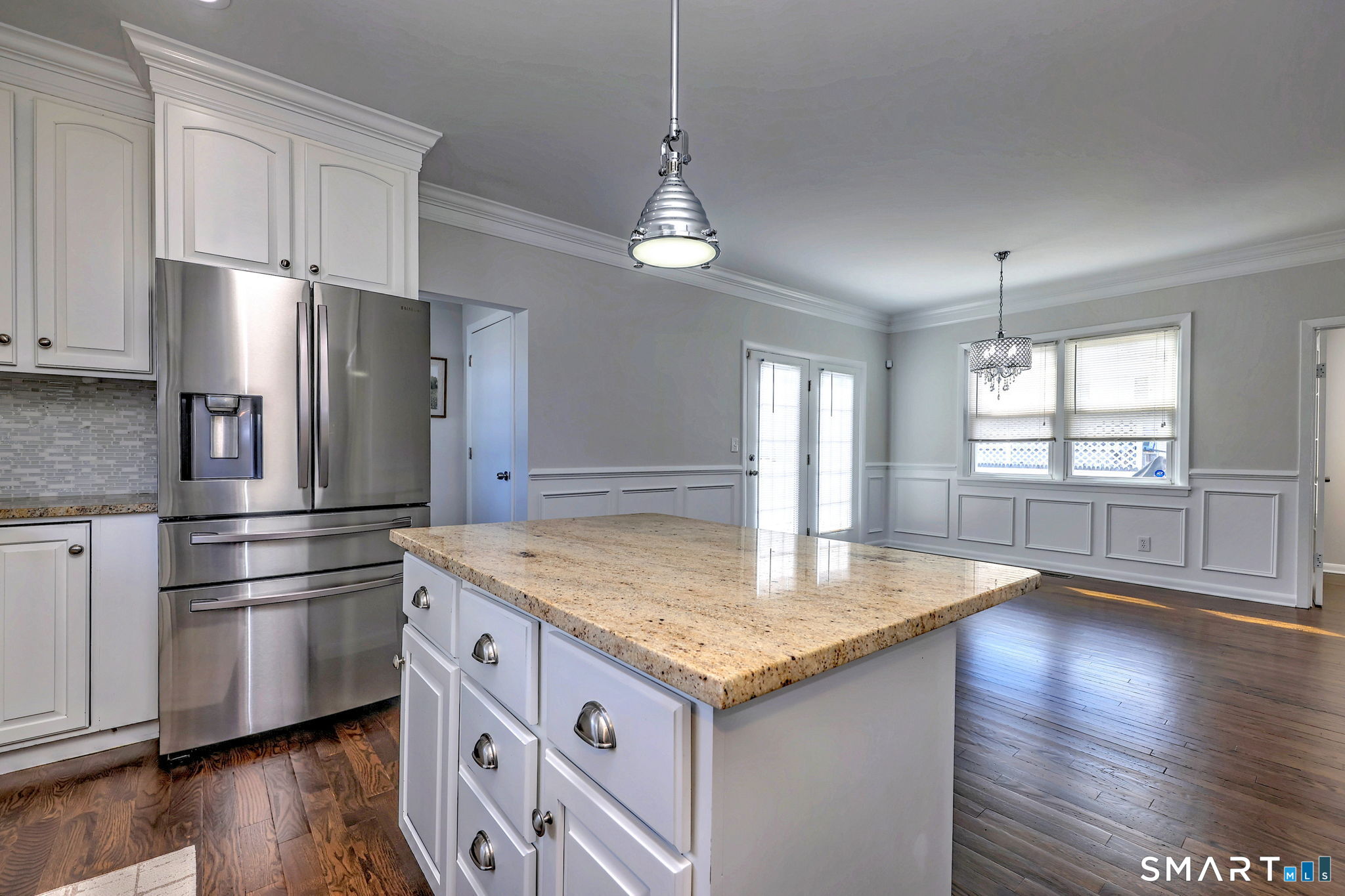 40 Yale Street Stratford, CT 06615 - Photo 5 of 31 a kitchen with stainless steel appliances granite countertop a refrigerator a sink dishwasher a stove and a refrigerator with wooden floor