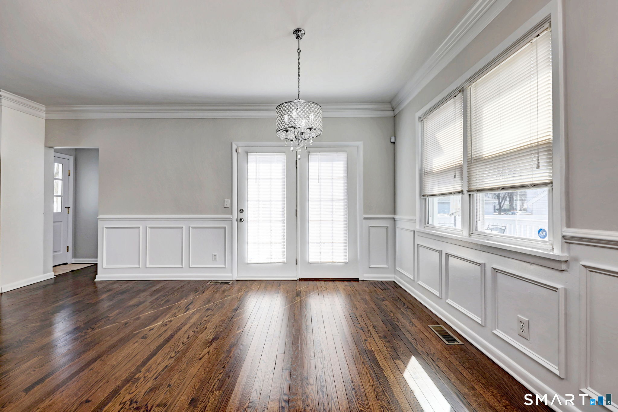 40 Yale Street Stratford, CT 06615 - Photo 6 of 31 a view of an empty room with wooden floor and a window