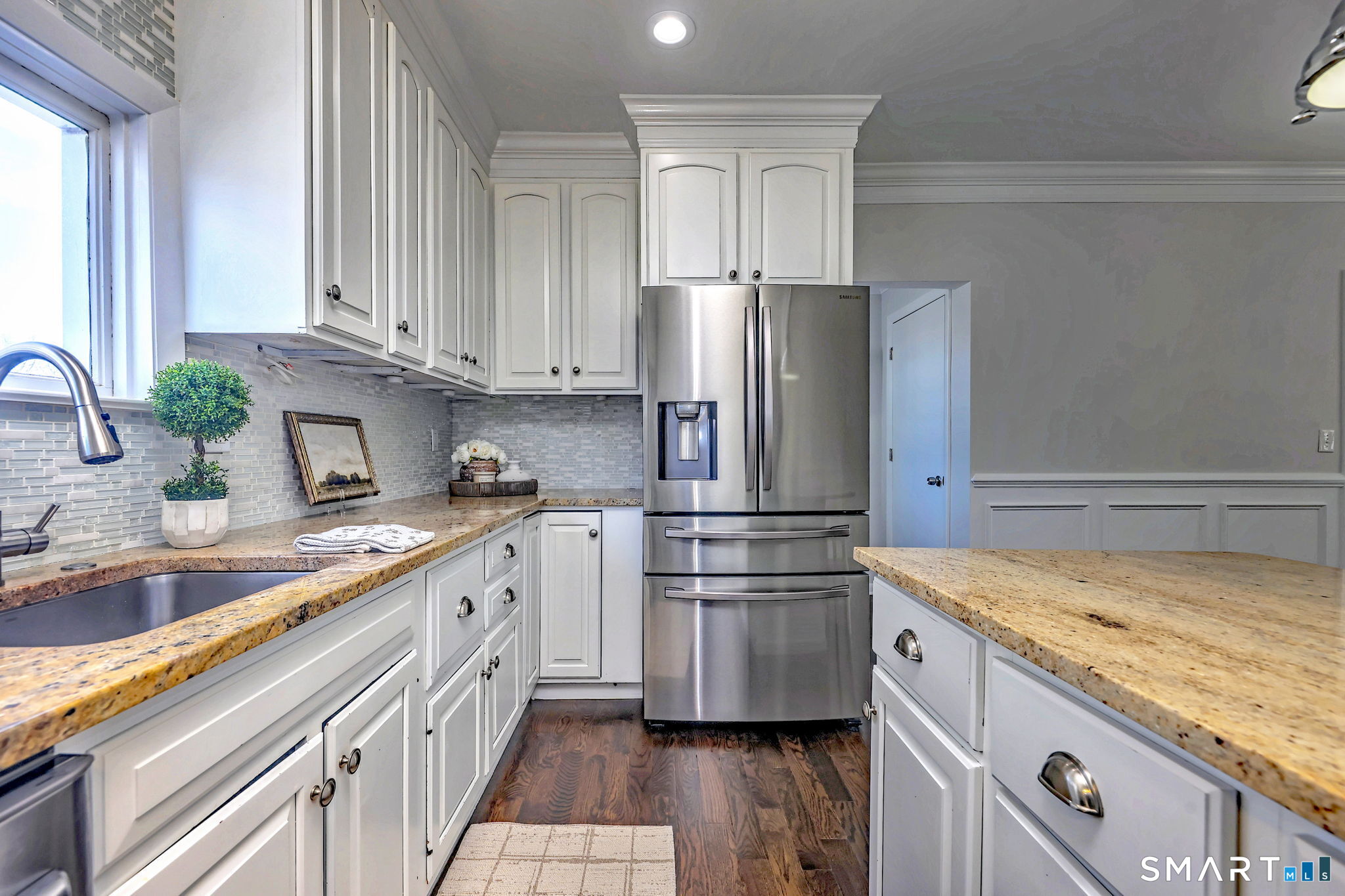 40 Yale Street Stratford, CT 06615 - Photo 7 of 31 a kitchen with a refrigerator and a sink