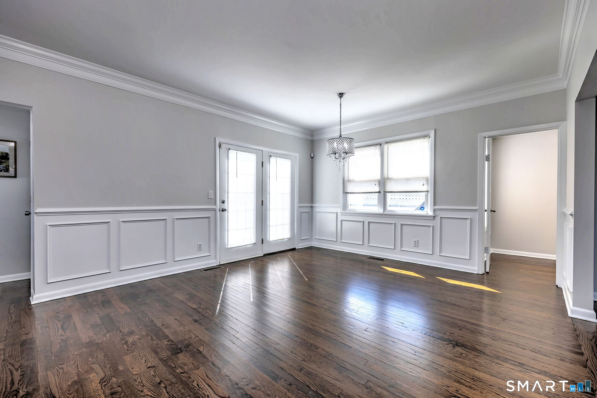 40 Yale Street Stratford, CT 06615 - Photo 9 of 31 a view of an empty room with wooden floor and fan