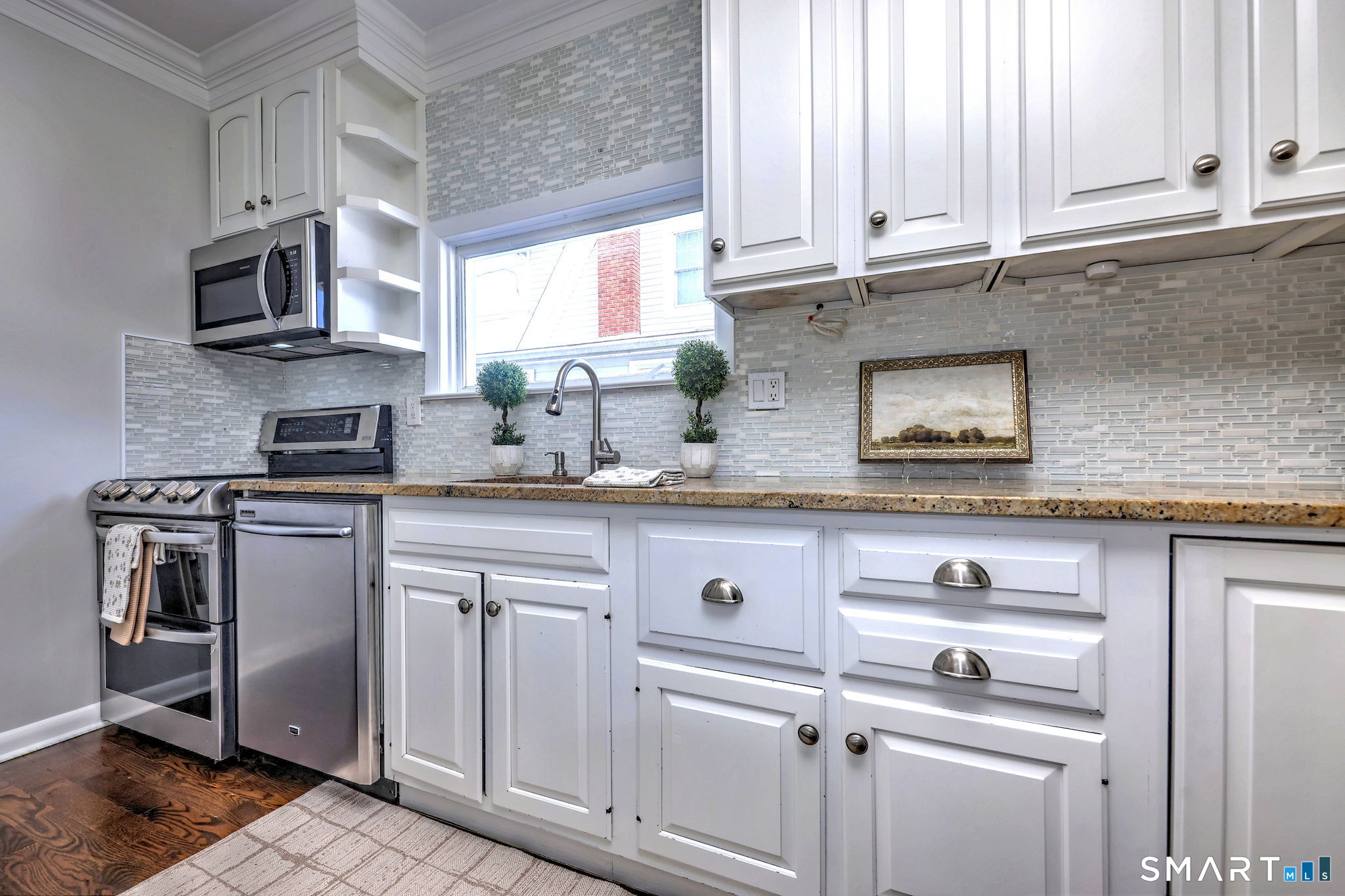 40 Yale Street Stratford, CT 06615 - Photo 10 of 31 a kitchen with stainless steel appliances granite countertop a sink and a microwave