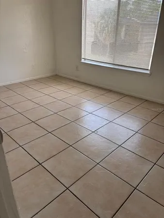 a view of a room that has a window in it