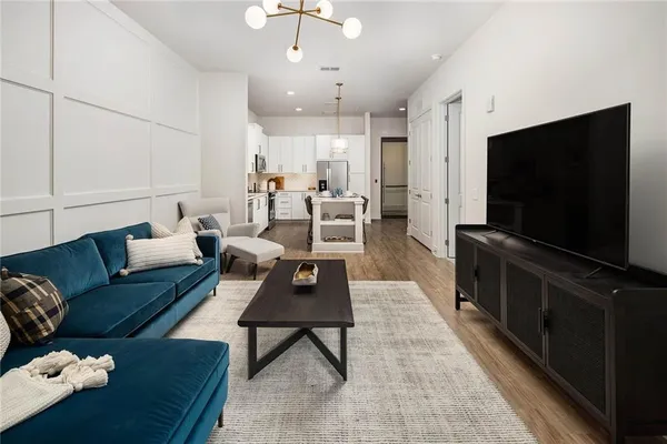 a living room with furniture and a flat screen tv
