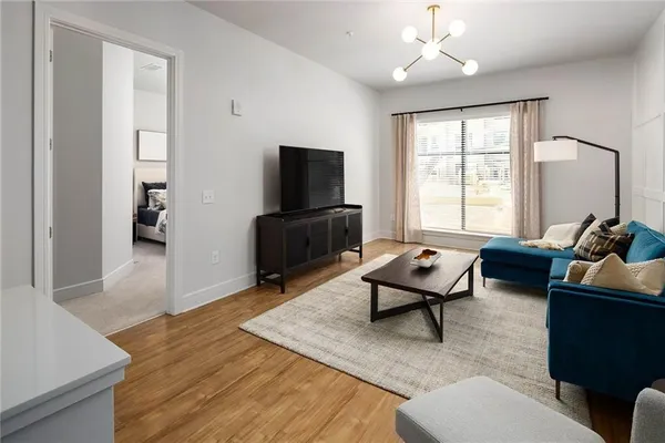 a living room with furniture and a flat screen tv