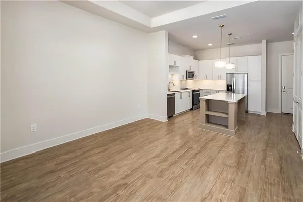 a view of kitchen with wooden floor
